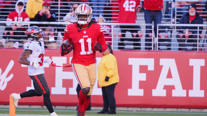 Nov 19, 2023; Santa Clara, California, USA; San Francisco 49ers wide receiver Brandon Aiyuk (11) runs after a catch for a 76-yard touchdown against the Tampa Bay Buccaneers during the third quarter at Levi's Stadium. Mandatory Credit: Kelley L Cox-USA TODAY Sports