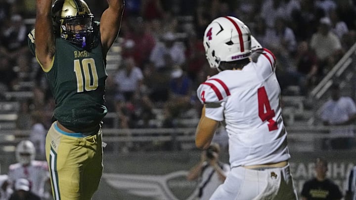 Millard South's Jett Thomalla (4) passes against pressure from Basha defensive end Darian (Bleu) Dantzler (10) during a game at Basha High School in Chandler on Aug. 30, 2024.