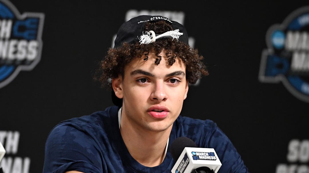 Illinois Fighting Illini guard Keaton Wagler (23) speaks in a press conference after defeating the Iowa Hawkeyes in an Elite Eight game of the South Regional of the men's 2026 NCAA Tournament at Toyota Center on March 28, 2026.