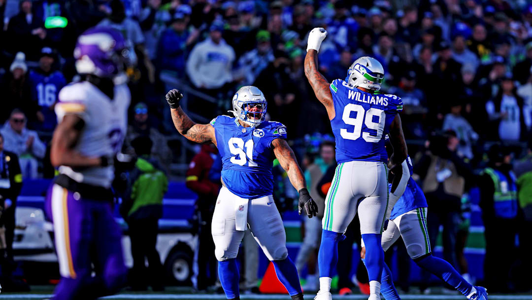 Nov 30, 2025; Seattle, Washington, USA; Seattle Seahawks defensive end Leonard Williams (99) celebrates after a play during the first half against the Minnesota Vikings at Lumen Field. Mandatory Credit: Kevin Ng-Imagn Images