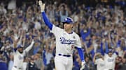Oct 25, 2024; Los Angeles, California, USA; Los Angeles Dodgers first baseman Freddie Freeman (5) celebrates after hitting a grand slam home run in the tenth inning against the New York Yankees during game one of the 2024 MLB World Series at Dodger Stadium. Mandatory Credit: Jayne Kamin-Oncea-Imagn Images