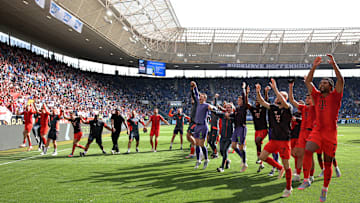 Bayern Munich players celebrating with fans after beating Hoffenheim on Saturday.