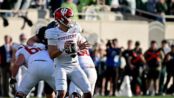 Nov 2, 2024; East Lansing, Michigan, USA;  Indiana Hoosiers quarterback Kurtis Rourke (9) looks for a receiver during the second quarter against the Michigan State Spartans at Spartan Stadium. Mandatory Credit: Dale Young-Imagn Images