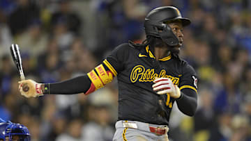 Apr 25, 2025; Los Angeles, California, USA;  Pittsburgh Pirates center fielder Oneil Cruz (15) hits a RBI single in the fifth inning against the Los Angeles Dodgers at Dodger Stadium. Mandatory Credit: Jayne Kamin-Oncea-Imagn Images