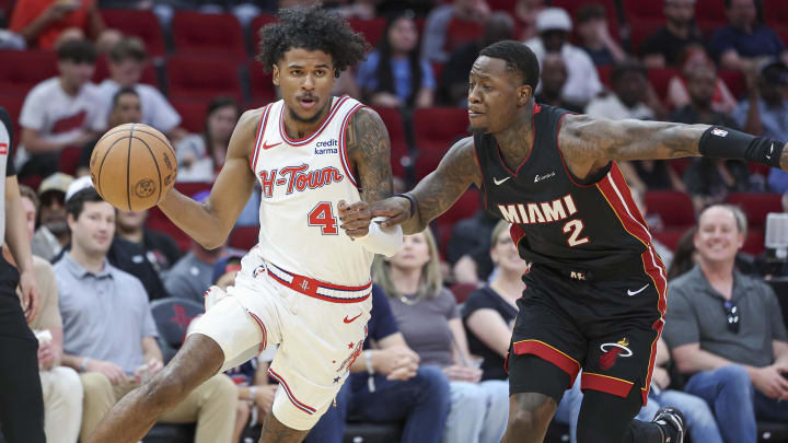 Apr 5, 2024; Houston, Texas, USA; Houston Rockets guard Jalen Green (4) drives with the ball as Miami Heat guard Terry Rozier (2) defends during the first quarter at Toyota Center. Mandatory Credit: Troy Taormina-USA TODAY Sports