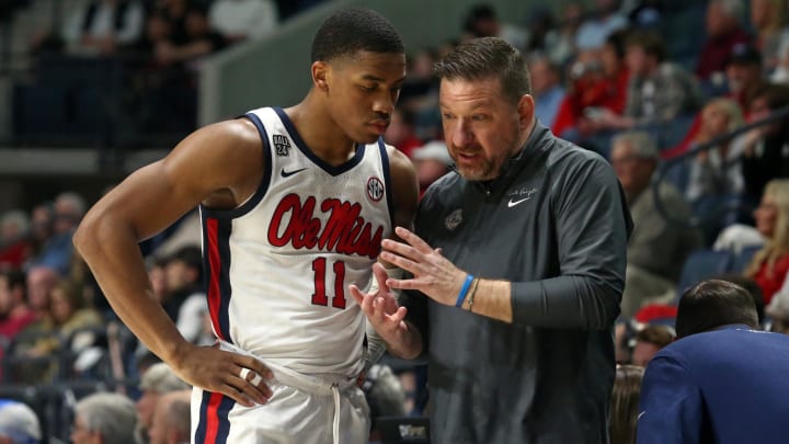 Feb 28, 2024; Oxford, Mississippi, USA; Mississippi Rebels head coach Chris Beard (right) talks with guard Matthew Murrell (11) during the second half against the Alabama Crimson Tide at The Sandy and John Black Pavilion at Ole Miss. Mandatory Credit: Petre Thomas-USA TODAY Sports