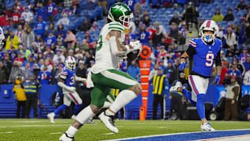 Dec 29, 2024; Orchard Park, New York, USA; New York Jets tight end Tyler Conklin (83) runs with the ball for a touchdown after making a catch against the Buffalo Bills during the second half at Highmark Stadium. 