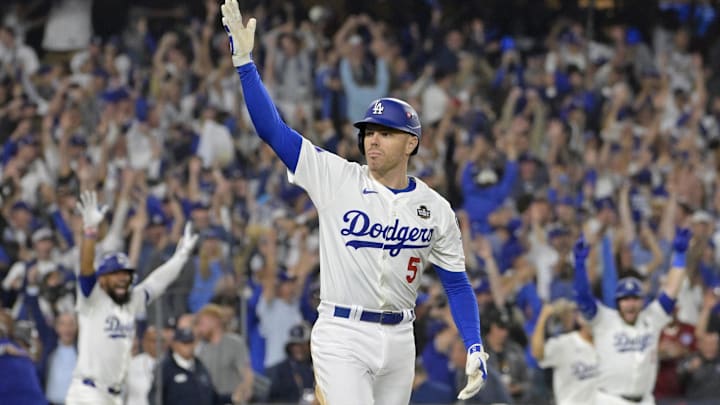 Los Angeles Dodgers first baseman Freddie Freeman celebrates after hitting a grand slam home run in the tenth inning against the New York Yankees during game one of the 2024 MLB World Series. Los Angeles Dodgers first baseman Freddie Freeman celebrates after hitting a grand slam home run in the tenth inning against the New York Yankees during game one of the 2024 MLB World Series.