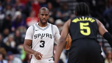Oct 31, 2024; Salt Lake City, Utah, USA; San Antonio Spurs guard Chris Paul (3) brings the ball up the court against Utah Jazz forward Cody Williams (5) during the second quarter at Delta Center. Mandatory Credit: Rob Gray-Imagn Images