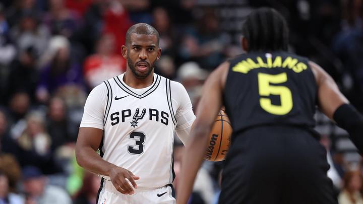Oct 31, 2024; Salt Lake City, Utah, USA; San Antonio Spurs guard Chris Paul (3) brings the ball up the court against Utah Jazz forward Cody Williams (5) during the second quarter at Delta Center. Mandatory Credit: Rob Gray-Imagn Images