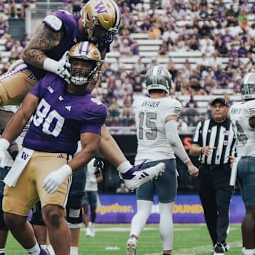 Elinneus Davis and Jacob Bandes celebrate Davis' first career sack.