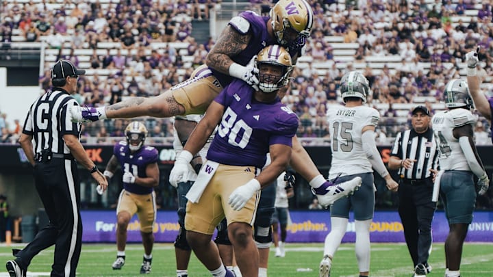 Elinneus Davis and Jacob Bandes celebrate Davis' first career sack.