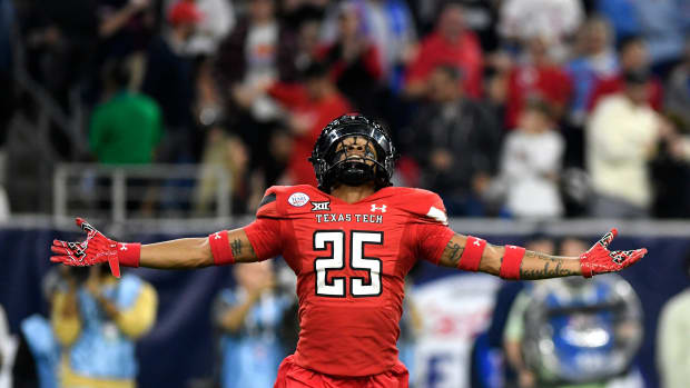 Texas Tech's defensive back Dadrion Taylor-Demerson (25) celebrates his interception against Ole