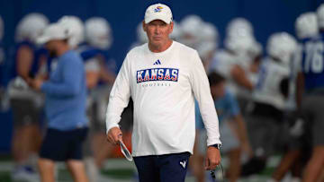 Kansas head coach Lance Leipold walks through different stations at an indoor practice Wednesday, July 31.