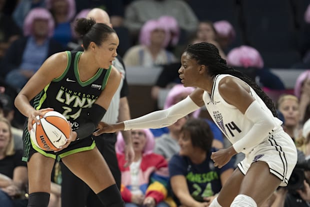 Minnesota Lynx forward Napheesa Collier looks to pass against Golden State Valkyries center Temi Fagbenle. 
