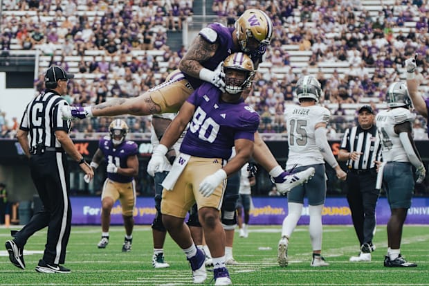 Elinneus Davis and Jacob Bandes celebrate Davis' first career sack.