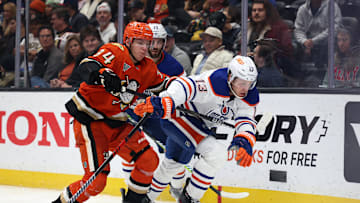 Edmonton Oilers center Mattias Janmark (13) and Anaheim Ducks defenseman Pavel Mintyukov (34)