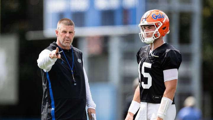 Florida Gators head coach Billy Napier talks with Florida Gators quarterback Graham Mertz (15) during fall football practice at Heavener Football Complex at the University of Florida in Gainesville, FL on Thursday, August 1, 2024. [Matt Pendleton/Gainesville Sun]