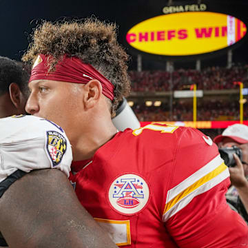 Sep 5, 2024; Kansas City, Missouri, USA; Kansas City Chiefs quarterback Patrick Mahomes (15) embraces Baltimore Ravens defensive tackle Broderick Washington (96) on field after the win over the game at GEHA Field at Arrowhead Stadium. Mandatory Credit: Denny Medley-Imagn Images