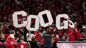 The Houston Cougars student section hold up cut out letter spelling “COOGS” during the game against the Lehigh Mountain Hawks at Fertitta Center. 