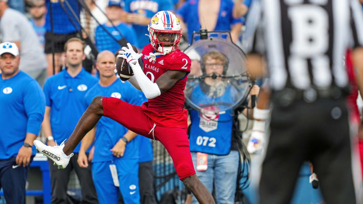 Sep 23, 2023; Lawrence, Kansas, USA; Kansas Jayhawks cornerback Cobee Bryant (2) intercepts a pass during the second half against the Brigham Young Cougars at David Booth Kansas Memorial Stadium.