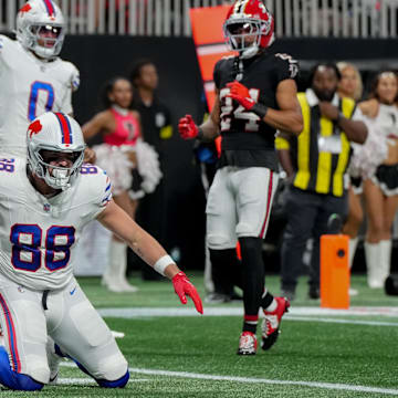 Oct 13, 2025; Atlanta, Georgia, USA; Buffalo Bills tight end Dawson Knox (88) reacts after catching a touchdown against the Atlanta Falcons during the first half of a game at Mercedes-Benz Stadium.