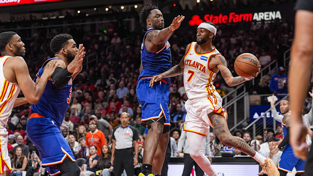 Apr 25, 2026; Atlanta, Georgia, USA; Atlanta Hawks guard Nickeil Alexander-Walker (7) passes the ball past New York Knicks forward Og Anunoby (8) during the second half during game four of the first round of the 2026 NBA Playoffs at State Farm Arena. Mandatory Credit: Dale Zanine-Imagn Images