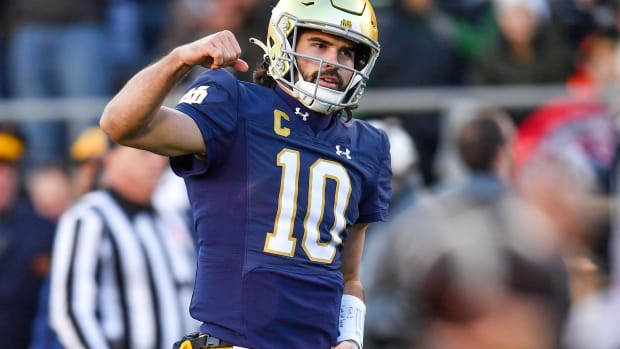 Sam Hartman throws a touchdown pass for Notre Dame