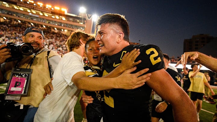 Oct 5, 2024; Nashville, Tennessee, USA;  Vanderbilt Commodores quarterback Diego Pavia (2) celebrates after an upset victory over the Alabama Crimson Tide at FirstBank Stadium. Mandatory Credit: Steve Roberts-Imagn Images