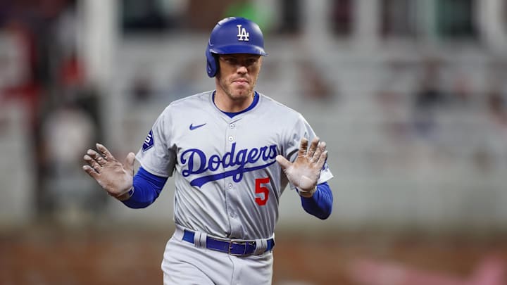 Los Angeles Dodgers first baseman Freddie Freeman (5) celebrates after a three-run home run against the Atlanta Braves in the seventh inning at Truist Park. 