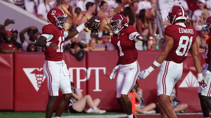 Sep 19, 2026; Tuscaloosa, Alabama, USA;  Alabama Crimson Tide quarterback Keelon Russell (12) celebrates with teammates after scoring a touchdown against the Florida State Seminoles during the secod half at Saban Field at Bryant-Denny Stadium.  Mandatory Credit: David Leong-Imagn Images