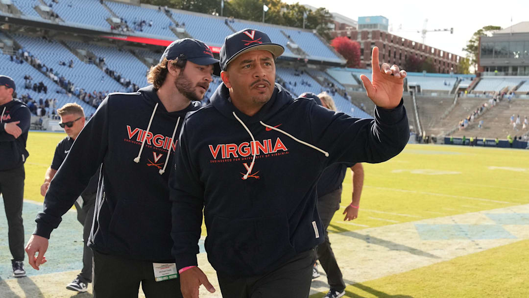 Oct 25, 2025; Chapel Hill, North Carolina, USA; Virginia Cavaliers head coach Tony Elliott runs off the field after defeating the North Carolina Tar Heels in overtime at Kenan Stadium. Mandatory Credit: Bob Donnan-Imagn Images