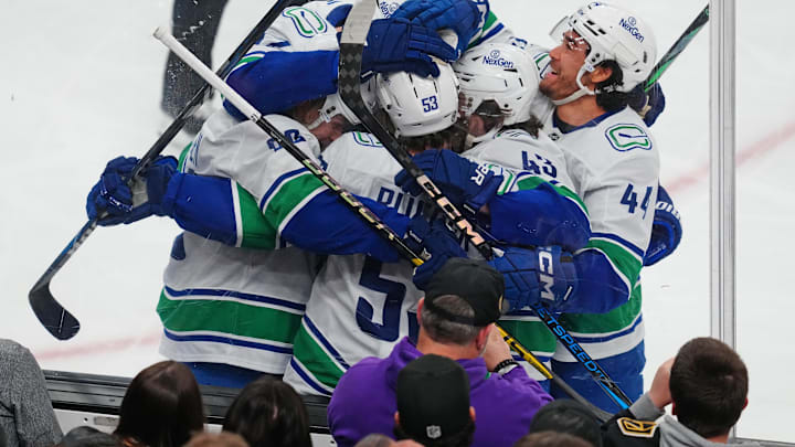 Dec 19, 2024; Las Vegas, Nevada, USA; Vancouver Canucks center Teddy Blueger (53) celebrates with team mates after scoring a goal against the Vegas Golden Knights during the first period at T-Mobile Arena. Mandatory Credit: Stephen R. Sylvanie-Imagn Images