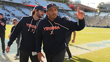 Oct 25, 2025; Chapel Hill, North Carolina, USA; Virginia Cavaliers head coach Tony Elliott runs off the field after defeating the North Carolina Tar Heels in overtime at Kenan Stadium. Mandatory Credit: Bob Donnan-Imagn Images