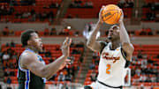 Feb 17, 2024; Stillwater, Oklahoma, USA; Oklahoma State Cowboys forward Eric Dailey Jr. (2) shoots the ball over Brigham Young Cougars forward Fousseyni Traore (45) during the first half at Gallagher-Iba Arena. Mandatory Credit: William Purnell-Imagn Images