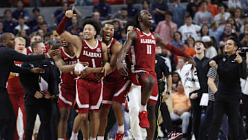 Mar 8, 2025; Auburn, Alabama, USA; Alabama Crimson Tide guard Mark Sears (1) celebrates with teammates after making the game winning shot to beat the Auburn Tigers in overtime at Neville Arena. Mandatory Credit: John Reed-Imagn Images