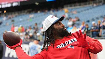 August 8, 2024; Foxborough, MA, USA;  New England Patriots linebacker Matthew Judon (9) plays catch with fans before a game against the Carolina Panthers at Gillette Stadium. Mandatory Credit: Eric Canha-USA TODAY Sports