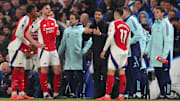 Mikel Arteta (centre) and his players have endured some highs and more lows this season