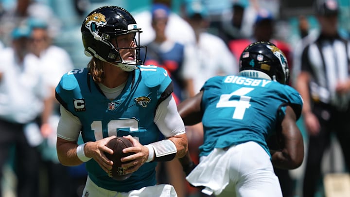 Sep 8, 2024; Miami Gardens, Florida, USA;  Jacksonville Jaguars quarterback Trevor Lawrence (16) drops back to pass against the Miami Dolphins in the first quarter at Hard Rock Stadium. Mandatory Credit: Jim Rassol-Imagn Images