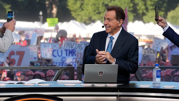 Oct. 4, 2025; Tuscaloosa, Alabama, USA; Pat McAfee takes a cell phone video of former Alabama head coach Nick Saban, now a co-host of the ESPN College GameDay show, as he comes on set on location on the Quad at the University of Alabama before the Alabama versus Vanderbilt game.