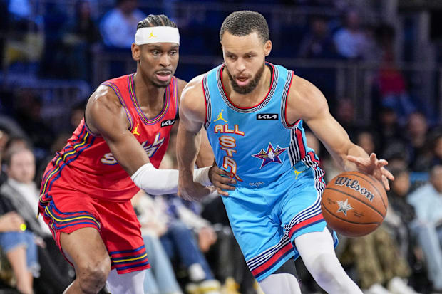 Shai Gilgeous-Alexander and Stephen Curry compete during the NBA All-Star Game.