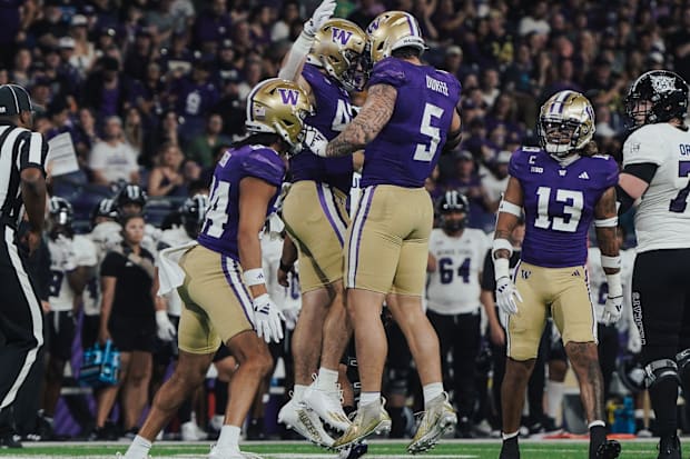 Zach Durfee (4) celebrates with Carson Bruener (42) against Weber State. 