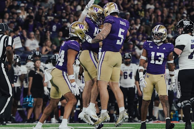 Zach Durfee (5) and Carson Bruener (42) chest bump during the Weber State game. 