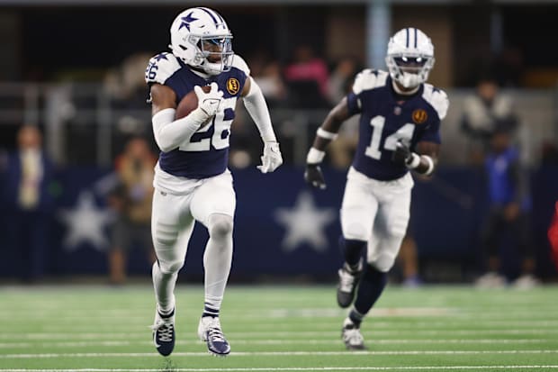 Dallas Cowboys cornerback DaRon Bland returns an interception for a touchdown