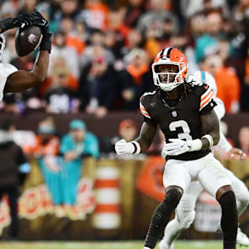Miami Dolphins linebacker Tyrel Dodson (11) intercepts a pass during the first half against the Cleveland Browns at Huntington Bank Field in Week 17. Mandatory Credit: Ken Blaze-Imagn Images