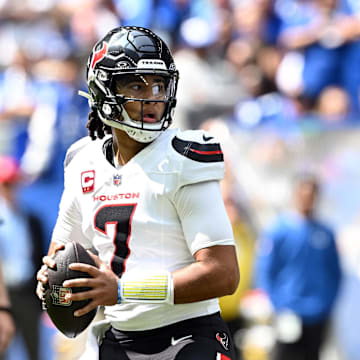 Sep 8, 2024; Indianapolis, Indiana, USA;  Houston Texans quarterback C.J. Stroud (7) looks for a teammate during the first quarter against the Indianapolis Colts at Lucas Oil Stadium. Mandatory Credit: Marc Lebryk-Imagn Images