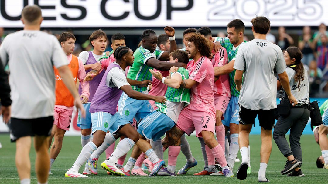 Inter Miami CF center back Maxi Falcon, 37, holds Seattle Sounders midfielder Obed Vargas while Sounders players try to free their teammate during a brawl started by Miami's Luis Suarez after Sunday's Leagues Cup final, a 3-0 Seattle victory.