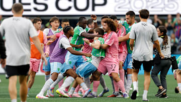 Inter Miami CF center back Maxi Falcon, 37, holds Seattle Sounders midfielder Obed Vargas while Sounders players try to free their teammate during a brawl started by Miami's Luis Suarez after Sunday's Leagues Cup final, a 3-0 Seattle victory.