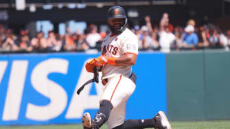 Jun 30, 2024; San Francisco, California, USA; San Francisco Giants center fielder Heliot Ramos (17) smiles after hitting a double against the Los Angeles Dodgers during the eighth inning at Oracle Park. Mandatory Credit: Kelley L Cox-USA TODAY Sports