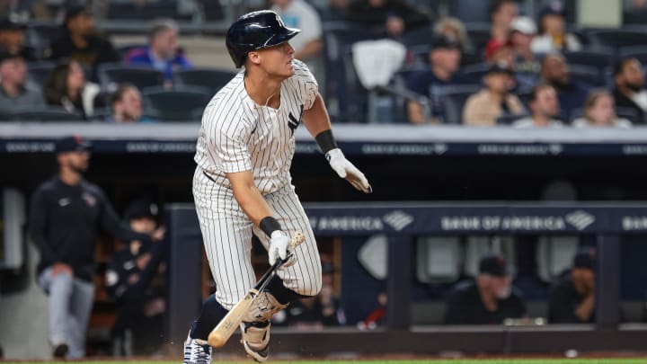 Aug 20, 2024; Bronx, New York, USA; New York Yankees shortstop Anthony Volpe (11) hits an RBI double during the fourth inning against the Cleveland Guardians at Yankee Stadium. Mandatory Credit: Vincent Carchietta-USA TODAY Sports